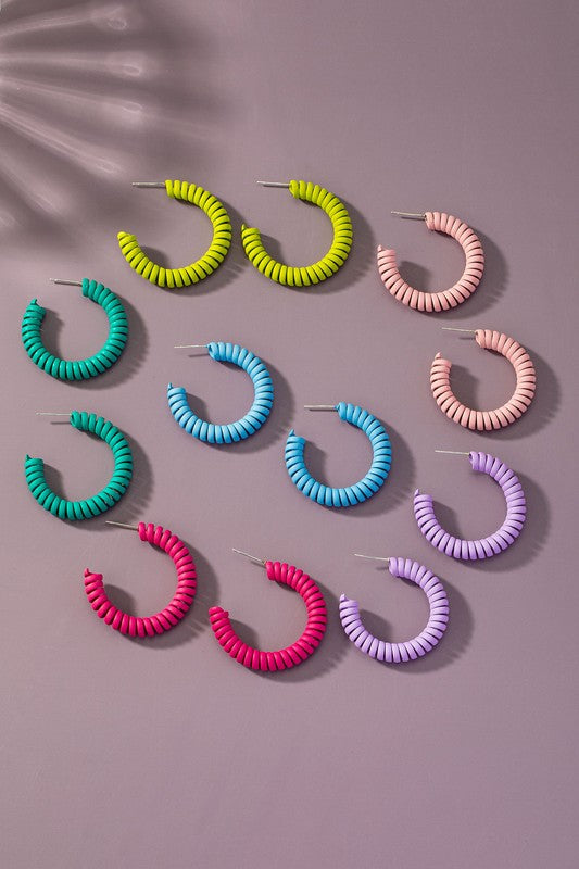 Spiral metal hoop earrings with color coating