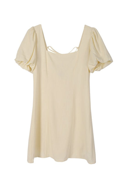 Scoop neck puff sleeve cream with back strap dress